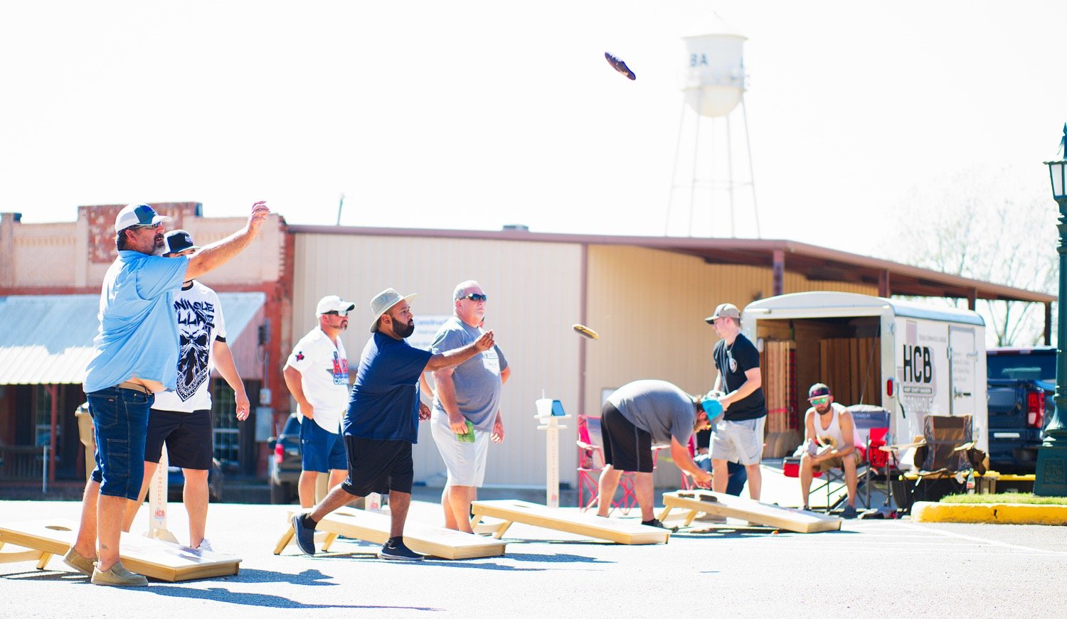 Dozens of competitors threw bags in downtown Alba on Saturday in a fundraising cornhole tournament for the Alba Volunteer Fire Dept. put on by Hunt County Baggers. [Bag a print.]